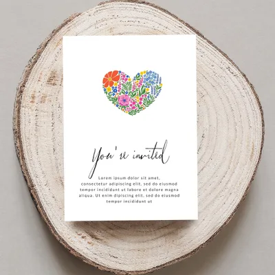 Invitation card with floral heart and "You're invited" text.
