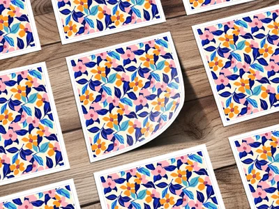 Several square stickers with a blue, pink, and orange floral pattern.