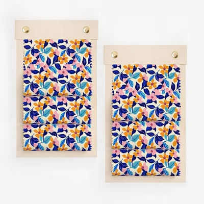 Fabric swatches with a blue, pink, and orange floral pattern.