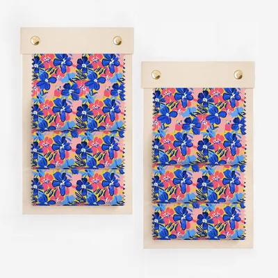 Two swatch displays of fabric with a blue and pink floral pattern.