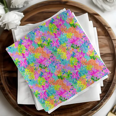 Stack of colorful floral patterned napkins on a wooden platter.