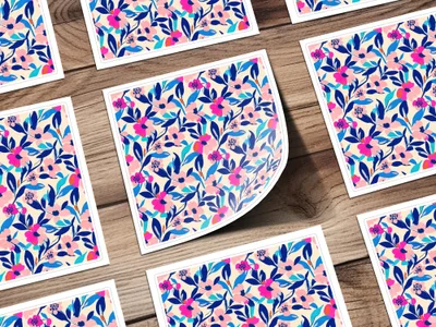 Floral pattern with blue, pink, and white flowers on a wooden background.