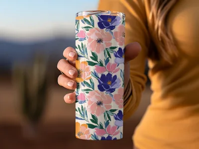 Tumbler with pink, blue, and purple floral pattern.