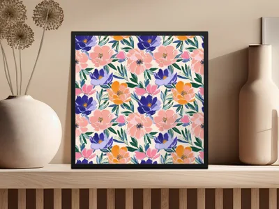 Framed artwork featuring a colorful floral pattern with pink, blue, and orange flowers.