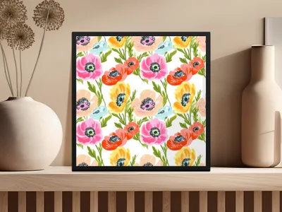 Framed artwork featuring a vibrant floral pattern of poppies and small blue flowers.