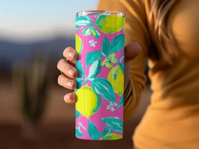 Pink tumbler with bright yellow lemons and green leaves pattern.