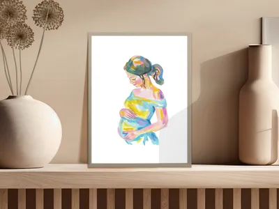 Watercolor painting of a pregnant woman with colorful dress, displayed on a shelf.