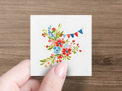 Floral bouquet with red, blue, and white bunting on a sticker.