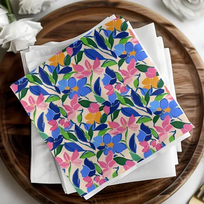 Stack of napkins with blue, pink, and yellow floral pattern.