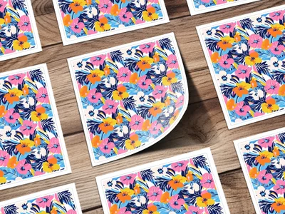 Floral pattern stickers with pink, blue, and yellow flowers on a wooden background.