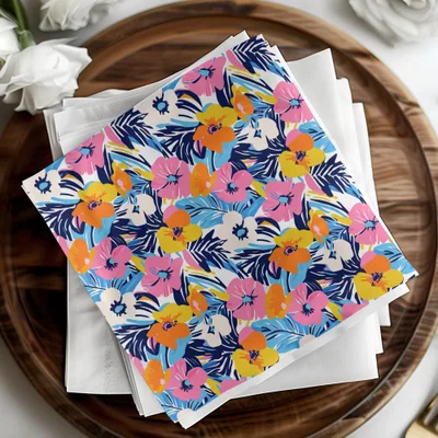 Floral patterned napkin on white napkins and wooden tray.