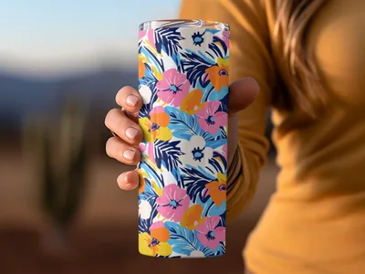 Tall tumbler with a vibrant floral pattern in blue, pink, and yellow.