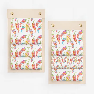 Fabric swatches with colorful chili pepper pattern.