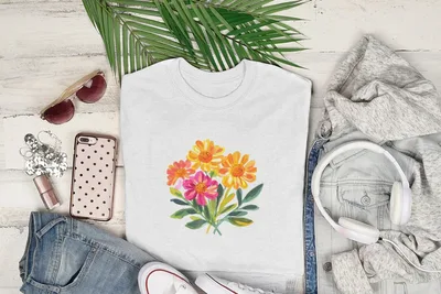 White t-shirt with colorful floral print and casual clothing flat lay.