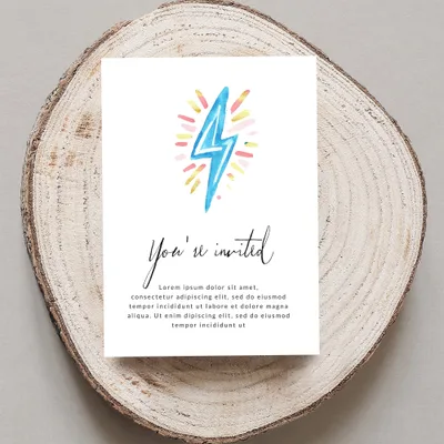 Invitation card with "You're invited" and watercolor lightning bolt.