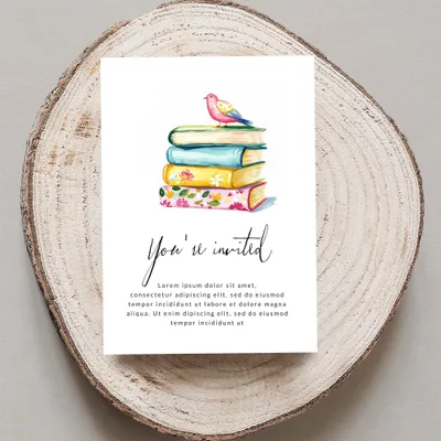 Invitation card with stack of colorful books and bird, "You're invited" text.
