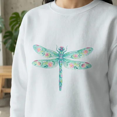 White sweatshirt with a colorful watercolor dragonfly and floral design.