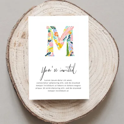 Invitation card with watercolor 'M' and "You're invited" text.