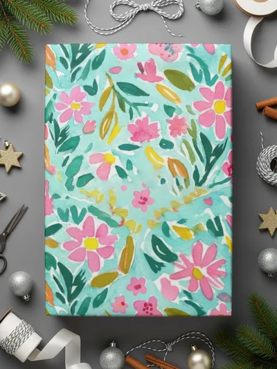 Gift wrap with pink and yellow flowers on a teal background.