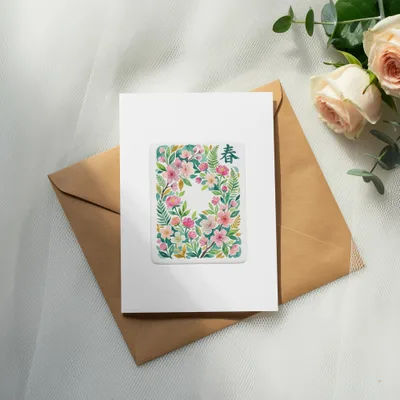 Greeting card with floral design and "Spring" in Japanese characters.