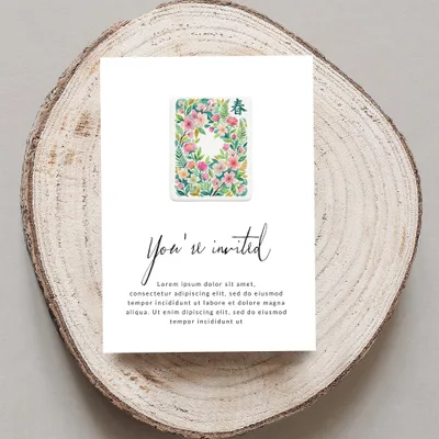 Invitation card with floral motif and "You're invited" text.