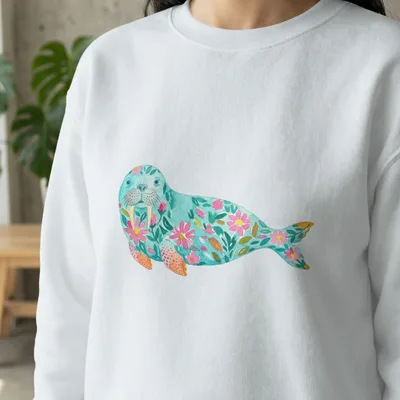 White sweatshirt with watercolor seal and floral design.