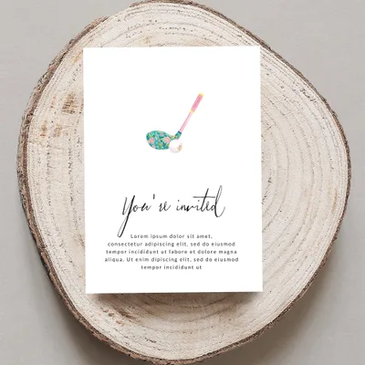 Golf club and floral pattern on a wedding invitation.