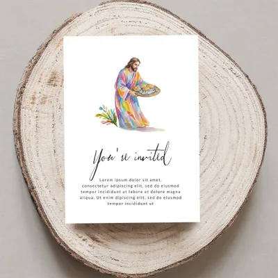 Invitation with Jesus holding a basket of bread and fish, text reads "You're invited".