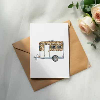 Card featuring a white teardrop camper with leopard print windows and flowers.