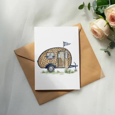 Watercolor illustration of a leopard print camper van on a card.