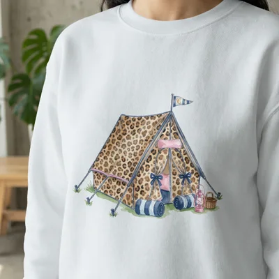 Leopard print tent with sleeping bags and lanterns.