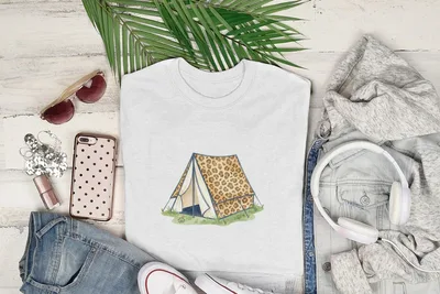 White t-shirt with leopard print tent graphic, laid flat with accessories.