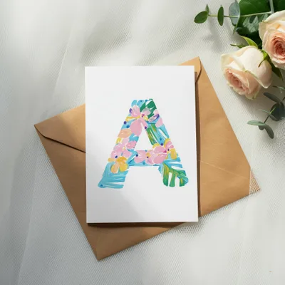 Card with a colorful letter "A" design on a brown envelope.
