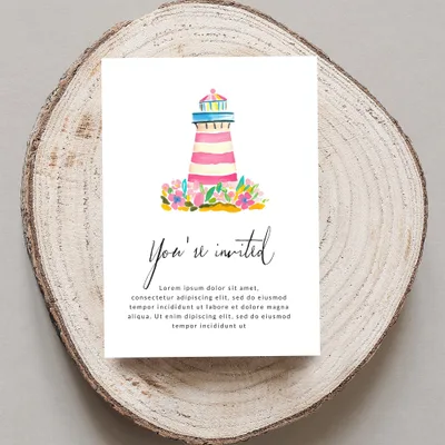 Watercolor lighthouse and flowers on invitation, "You're invited" text.
