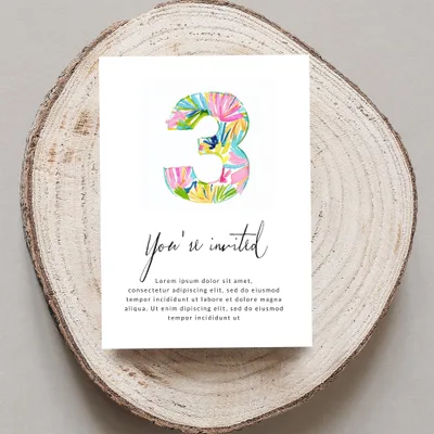 Invitation with large watercolor number 3 and text.
