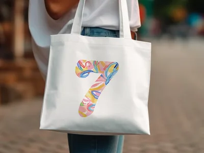 White tote bag with colorful abstract number 7 design.