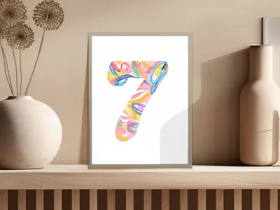 Abstract watercolor number 7 print with colorful shapes on a shelf.