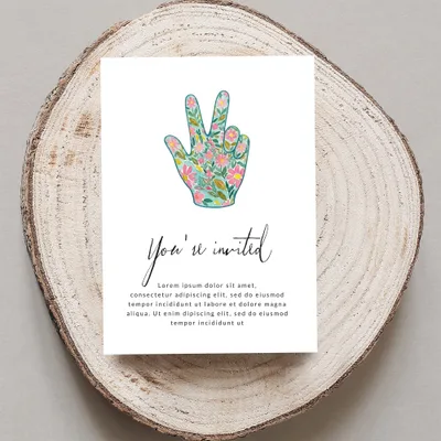 Invitation card with floral peace sign and placeholder text.