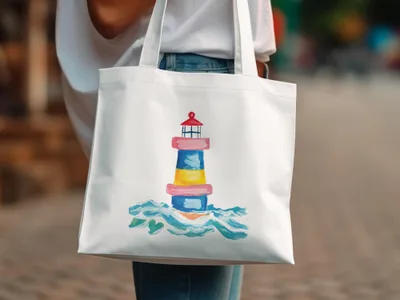 Watercolor lighthouse on a white canvas tote bag.