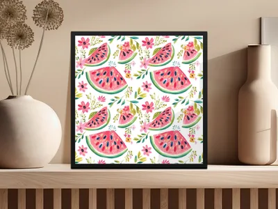 Framed artwork featuring a pattern of sliced watermelons and pink flowers.
