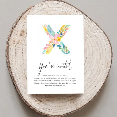 Invitation card with floral 'X' and placeholder text.
