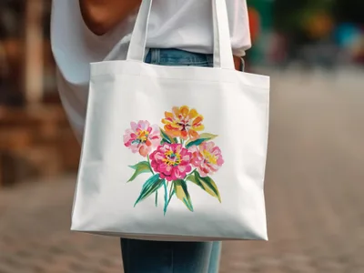 White tote bag with a watercolor floral bouquet illustration.