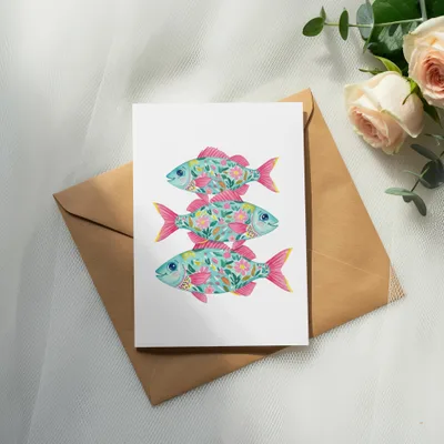 Card featuring three decorative, floral-patterned fish stacked vertically.