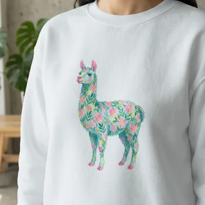 White sweatshirt with a colorful floral llama illustration.